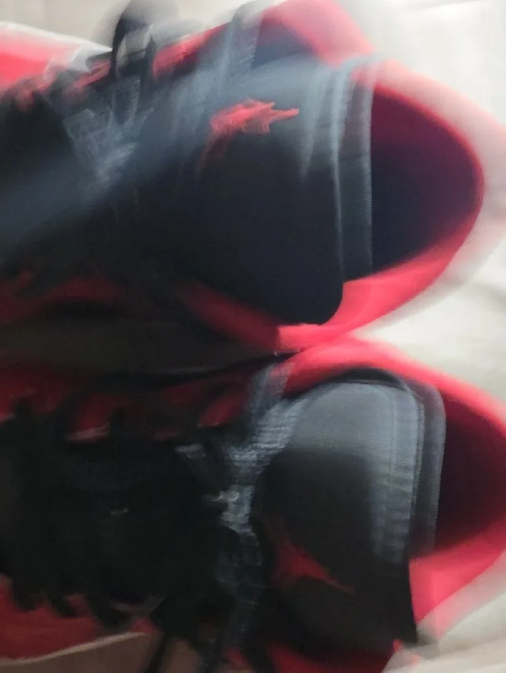 Jordan Red and Black High-Top Sneaker Tongue Label Detail